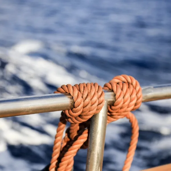 Hand-tied rope binding above the Atlantic swell
